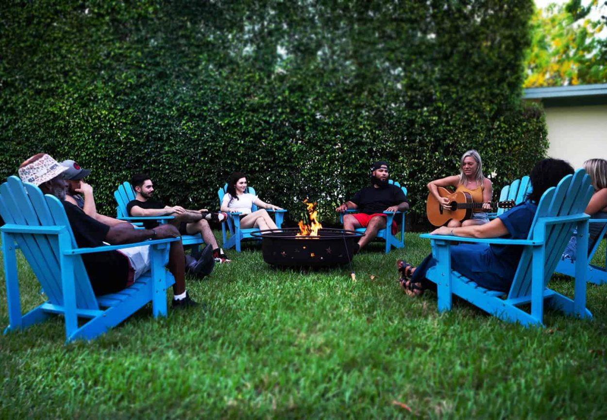Amenities, people seating around fire pit