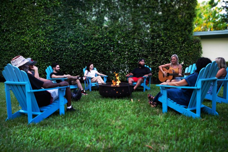 Amenities, people seating around fire pit